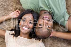 Young couple at home relaxing on the floor