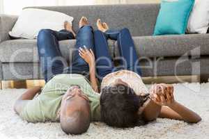 Young couple relaxing on the floor