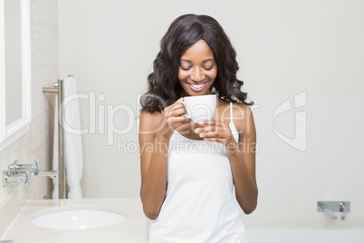 Young woman holding coffee mug Young woman holding coffee mug