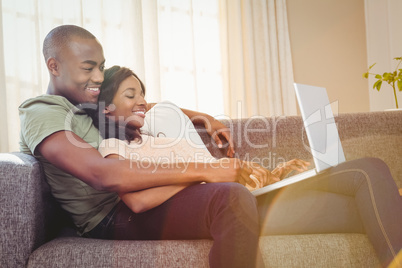 Young couple using a laptop