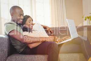 Young couple using a laptop