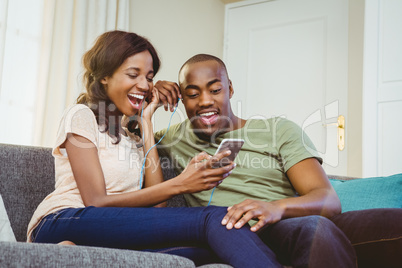 Young couple using mobile phone