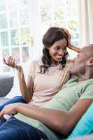 Young couple relaxing on the sofa