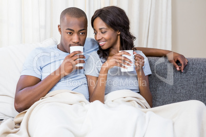 Young couple relaxing on a sofa