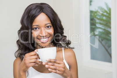 Young woman holding coffee mug