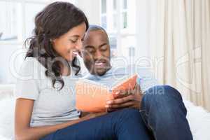 Young couple reading book