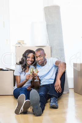 Young couple toasting glasses of champagne