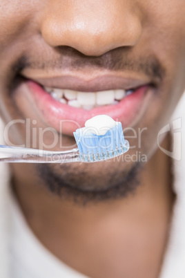 Close-up of a man holding tooth brush