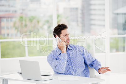 Businessman talking on mobile phone