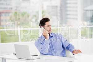 Businessman talking on mobile phone