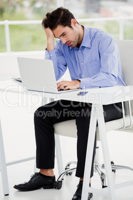 Businessman working on laptop