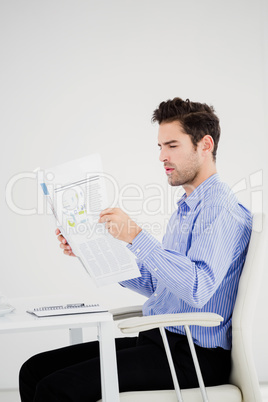 Businessman reading a newspaper