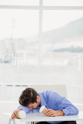 Businessman relaxing on desk