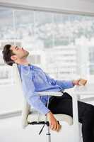 Businessman relaxing on chair