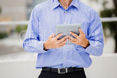 Businessman holding digital tablet