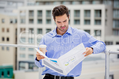 Businessman reading a newspaper