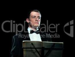 Studio image of young man conducts the orchestra