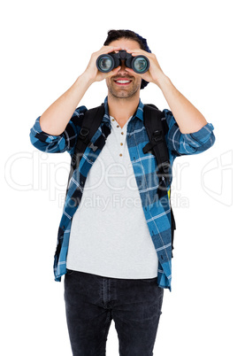 Young man looking through binocular