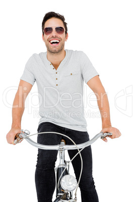 Young man in sunglasses cycling