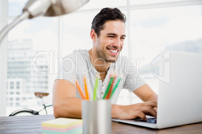 Young man working at his desk