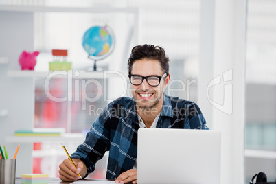 Young man working at his desk