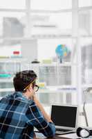 Young man working at his desk