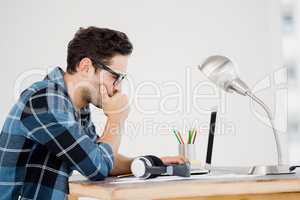 Young man working at his desk