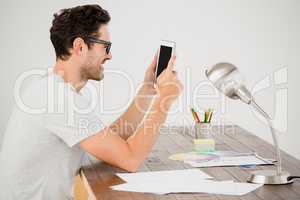 Young man using digital at his desk