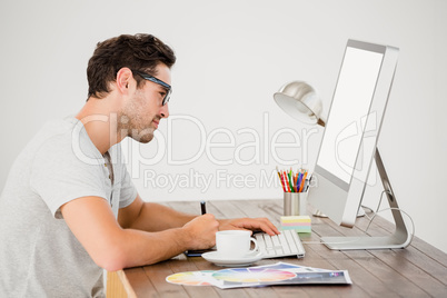 Young man using pen tablet and computer