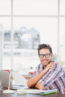 Young man sitting at his desk