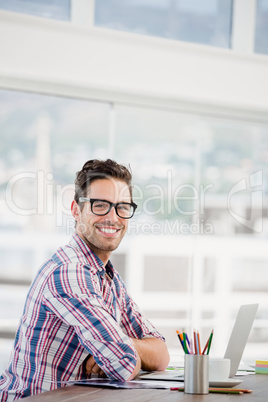 Young man sitting at his desk