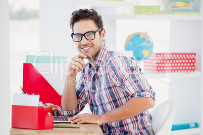 Young man sitting at his desk