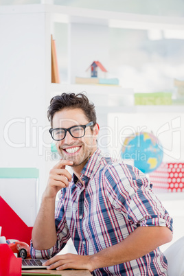 Young man sitting at his desk