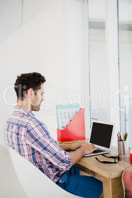 Young man working at his desk