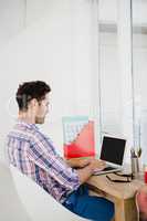 Young man working at his desk