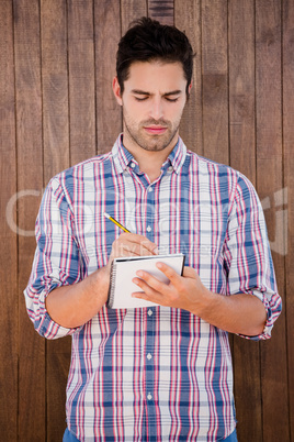 Man writing in a diary