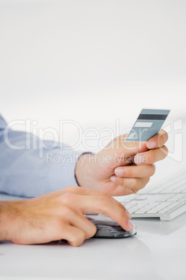 Close-up of mans hand holding a credit card