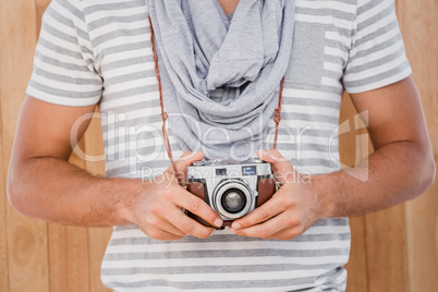 Man standing with a camera