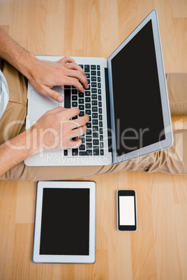 A Man is using a laptop