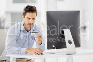 Businessman doing online shopping on computer