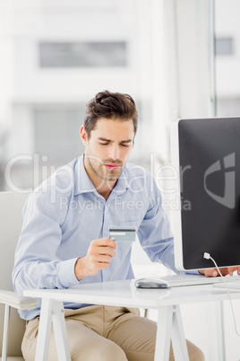 Businessman doing online shopping on computer