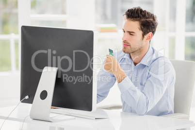 Businessman doing online shopping on computer