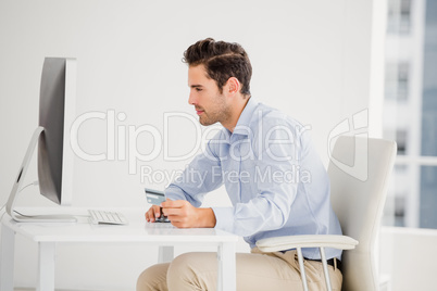 Businessman doing online shopping on computer