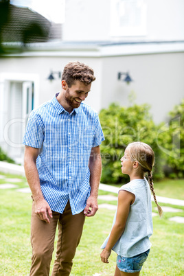 Smiling father standing with daughter