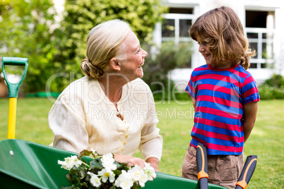 Smiling granny with grandson at yard