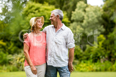 Senior couple standing in yard