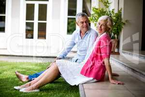 Senior couple relaxing on steps