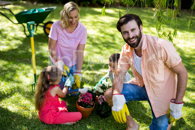 Father against family during gardening