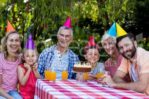 Family celebrating birthday at yard