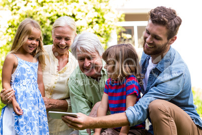 Smiling father taking selfie with family